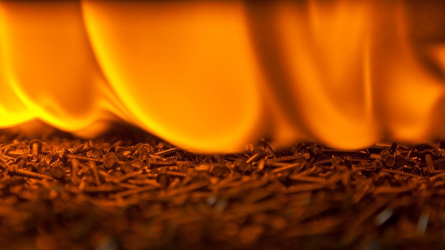Metal parts entering furnace